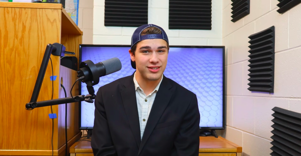 Asher Boekestein prepares to record a video in his dorm-room studio.