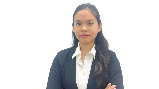 This image shows Thea Sreynit of Students For Liberty with her arms crossed, in a pose of professional power.