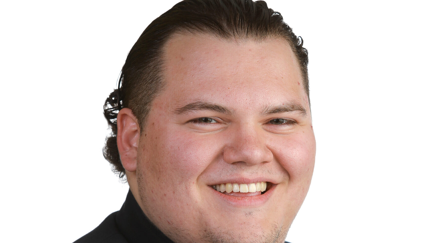 Leam Dunn-Opper of Students For Liberty poses powerfully and smiles gracefully.